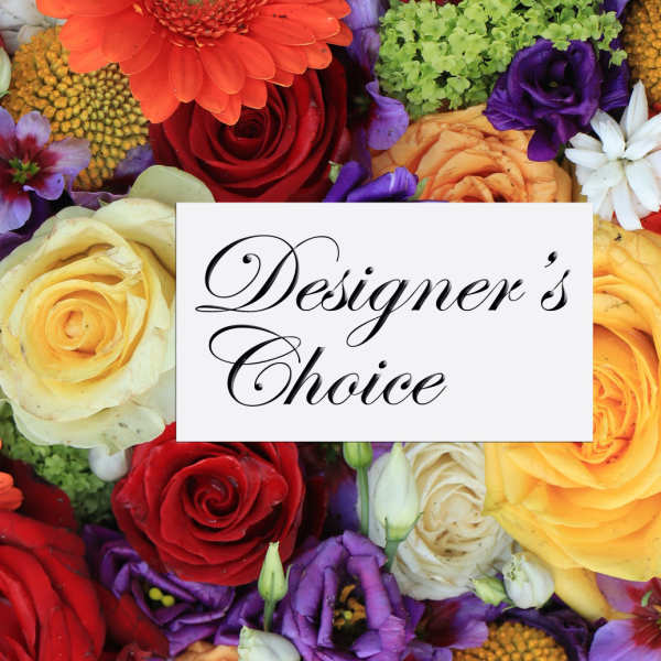 Mixed bouquet of roses and colorful flowers with a Designer's Choice sign