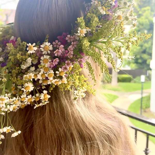 Flower crown with small white, pink, and purple blossoms