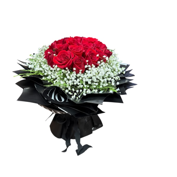 Bouquet of red roses with white baby's breath wrapped in black paper