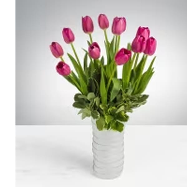 Pink tulips arranged in a white vase