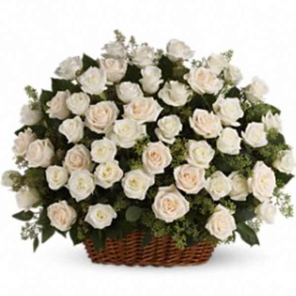 Basket of white roses with pale blush centers