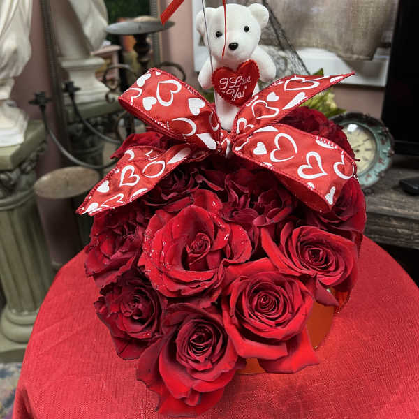 Red rose bouquet with a teddy bear and heart balloon