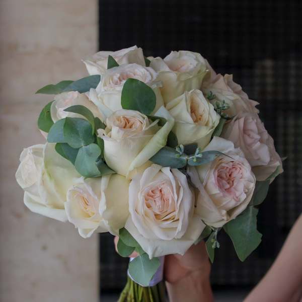Bouquet of cream and blush roses with eucalyptus