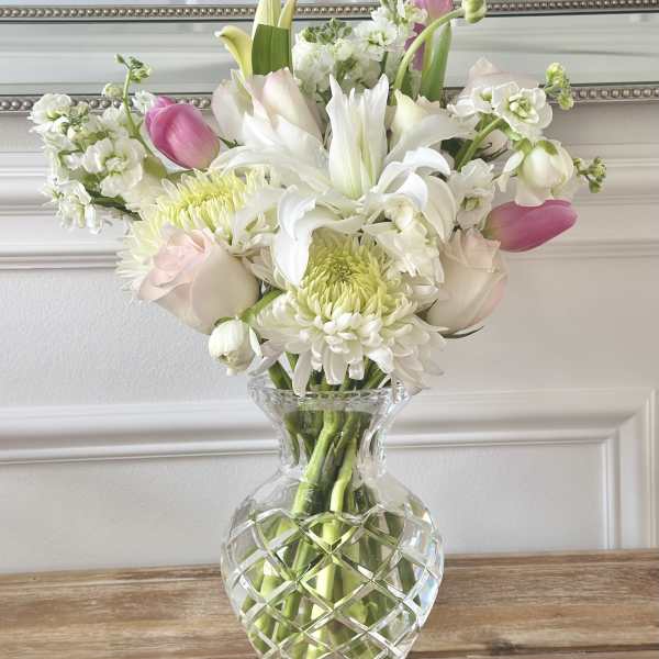 Pink and white mixed bouquet in a clear glass vase