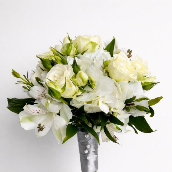 White bouquet with roses and lilies wrapped in silver ribbon