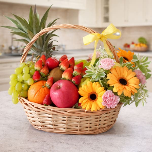 Fruit basket with flowers in a wicker basket