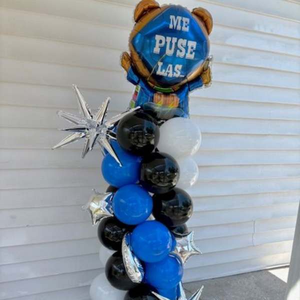 Blue, black, and white balloon column with silver star balloons