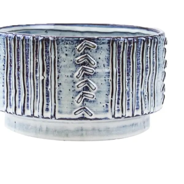 Blue and white ceramic planter with vertical ridges