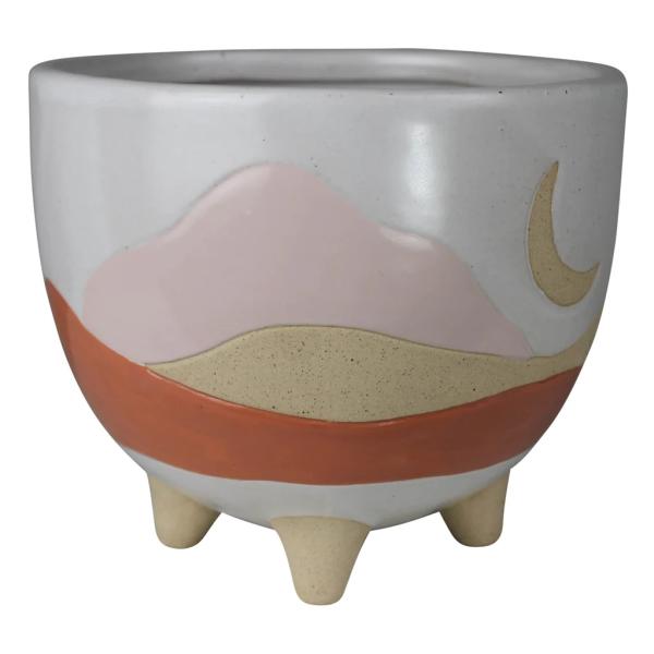Ceramic planter with a pastel landscape design and three short legs