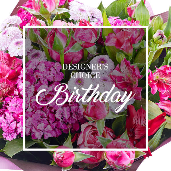Designer’s choice birthday bouquet of mixed pink and white flowers in a tight arrangement.
