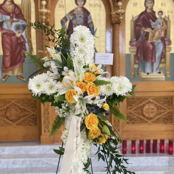 Standing floral cross with white chrysanthemums and yellow roses