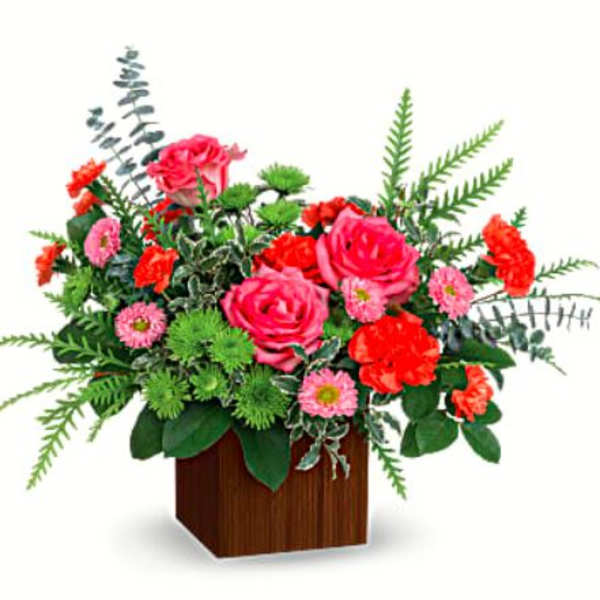 Pink roses and red carnations in a wooden cube vase