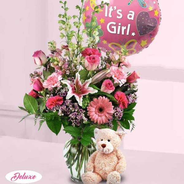 Pink mixed flower bouquet with a "It's a Girl" balloon and teddy bear