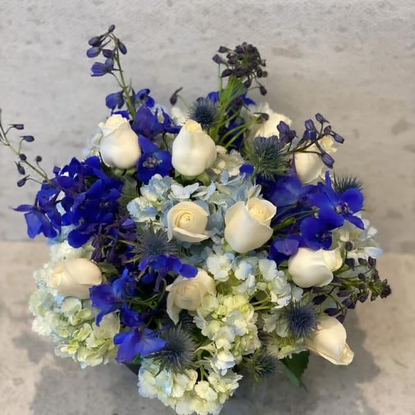 Blue and white bouquet with roses and hydrangeas