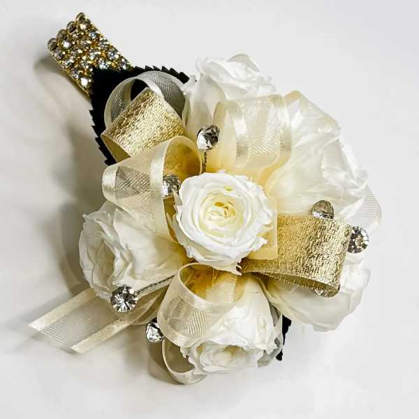 White rose corsage with gold and ivory ribbon, rhinestones, and a jeweled wrist band