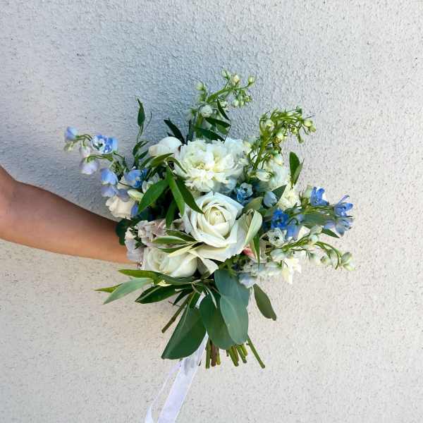 White and blue bouquet with roses and mixed blooms