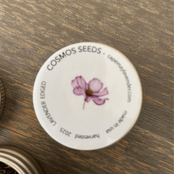 Round seed packet lid with a pink flower illustration