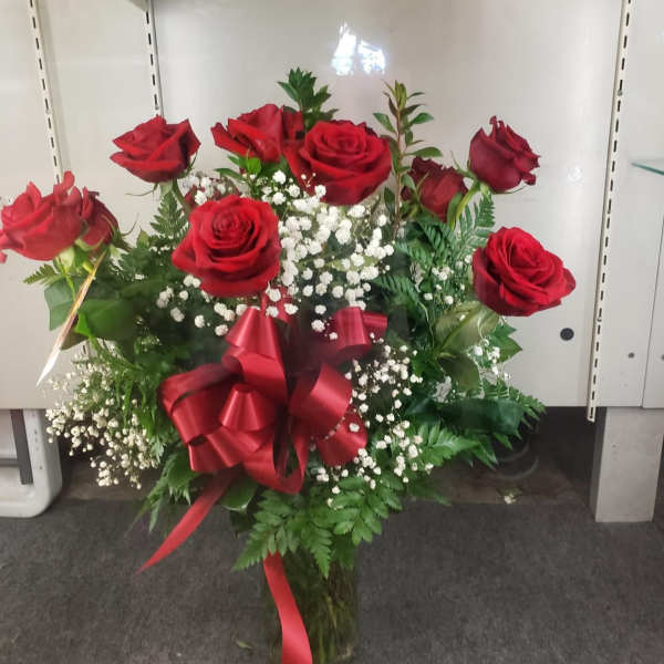 Bouquet of red roses with baby's breath and a red ribbon