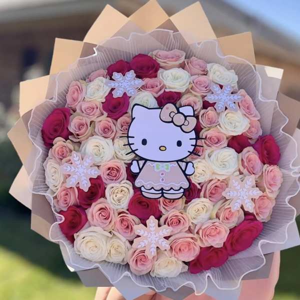 Bouquet of pink, white, and red roses with a Hello Kitty topper