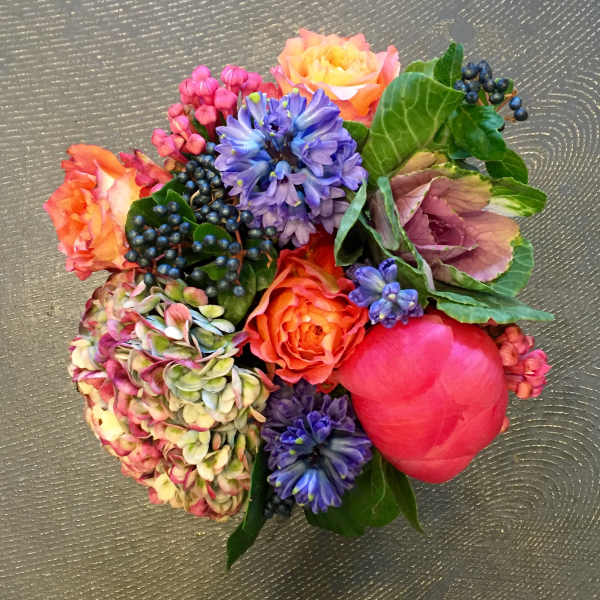 Colorful bouquet with roses, hydrangea, and purple blooms