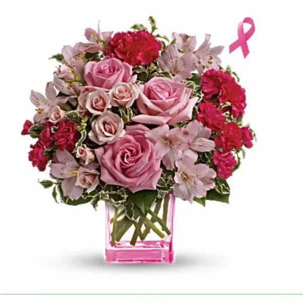 Pink arrangement of roses, carnations, and alstroemeria in a pink glass cube vase with a pink ribbon icon