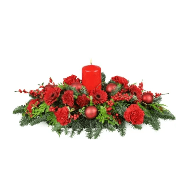 Red candle centerpiece with red flowers and ornaments