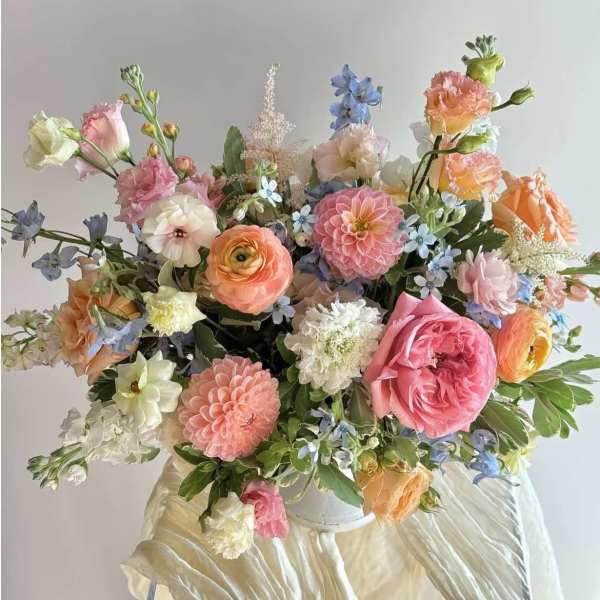 Large pastel bouquet with roses, dahlias, and mixed blooms