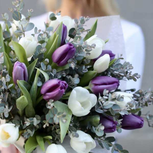 Bouquet of purple and white tulips with eucalyptus