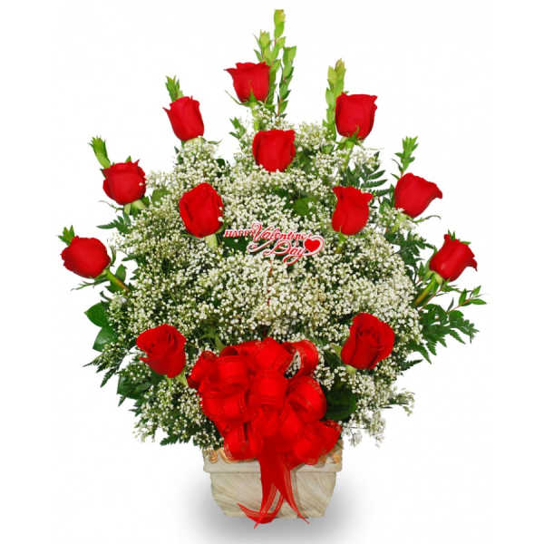 Red roses arranged in a white vase with a red bow
