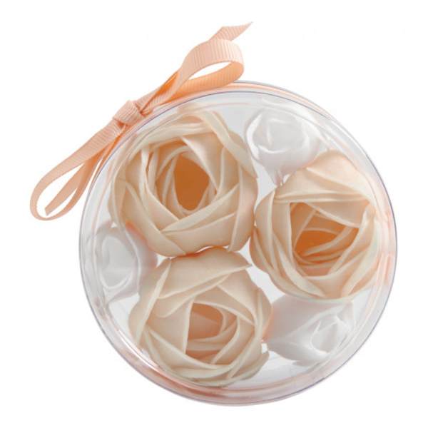 Round clear box with pale peach roses and a ribbon bow