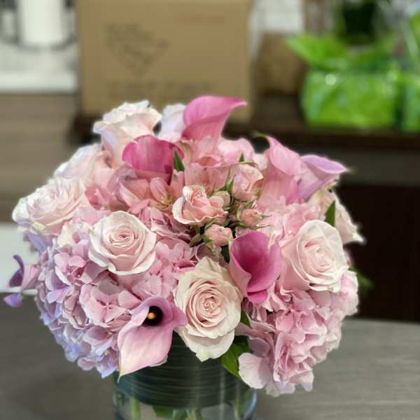 Pink and white bouquet in a glass vase