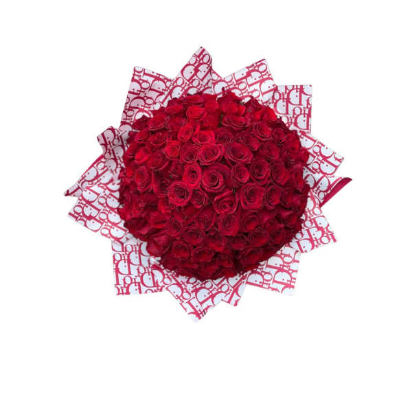 Large bouquet of red roses wrapped in patterned paper