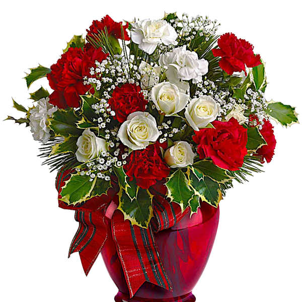 Red and white roses in a red glass vase with a ribbon
