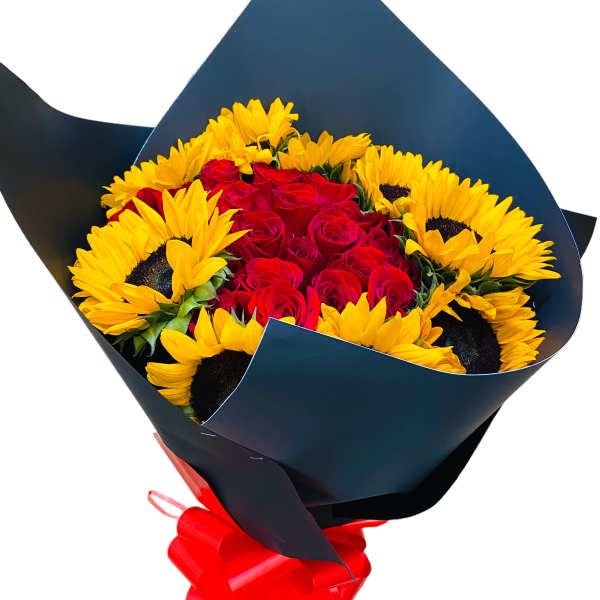 Bouquet of red roses and yellow sunflowers wrapped in dark paper with a red bow