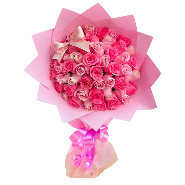 Pink rose bouquet wrapped in pink paper with a satin bow