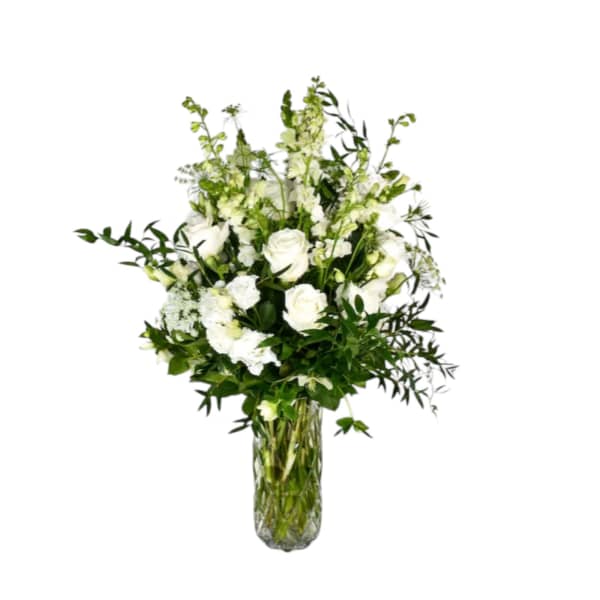 White floral arrangement in a clear glass vase