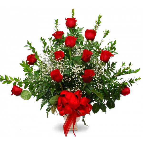 Bouquet of red roses with baby's breath in a vase, tied with a red ribbon