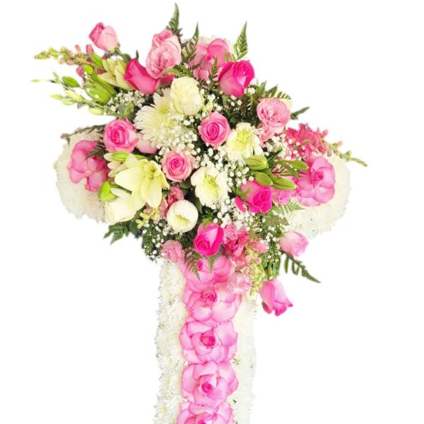 Pink and white floral cross arrangement with roses and lilies