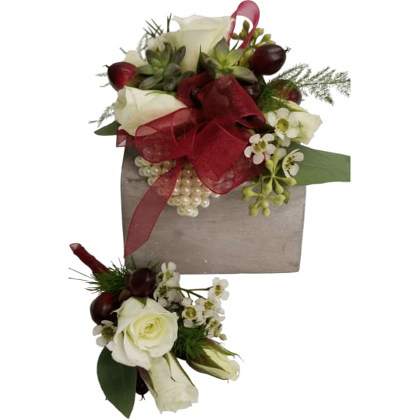 White rose bouquet with red ribbon and matching boutonniere