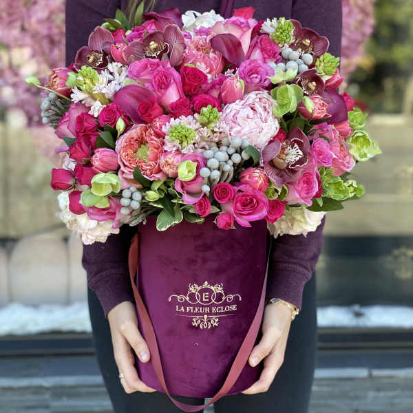 Large pink and purple bouquet in a velvet hatbox