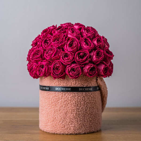 Hot pink rose arrangement in a textured blush hatbox