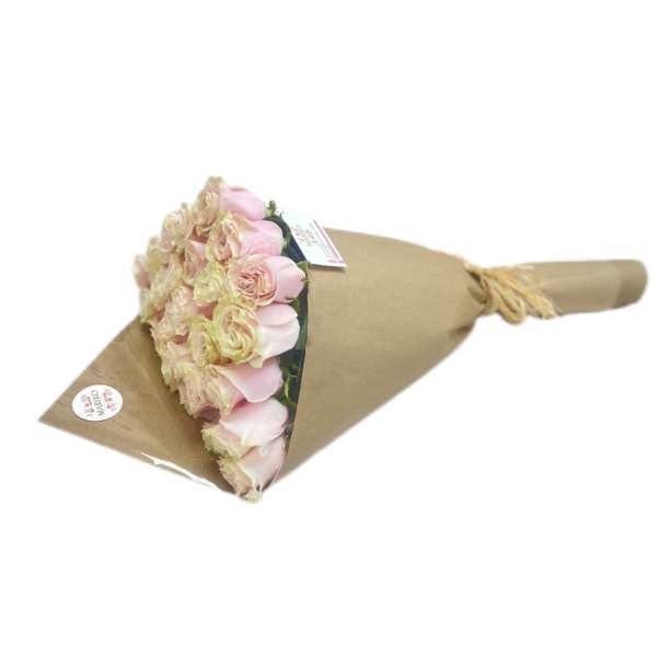 Bouquet of pale pink roses wrapped in brown paper