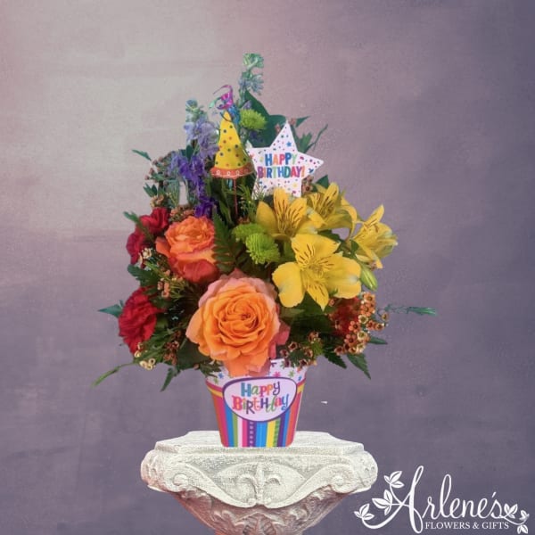 Birthday bouquet in a striped pot with a star topper