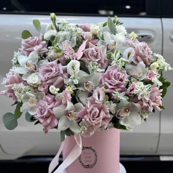 Pink and white bouquet in a pink hatbox with ribbon