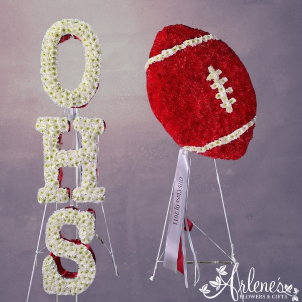 Floral football and OHS letters made of white and red flowers on stands