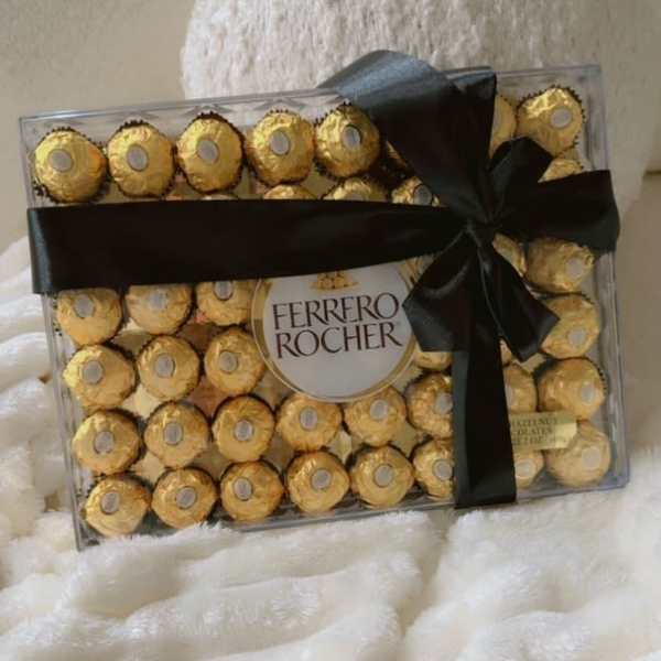 Box of Ferrero Rocher chocolates tied with a black ribbon