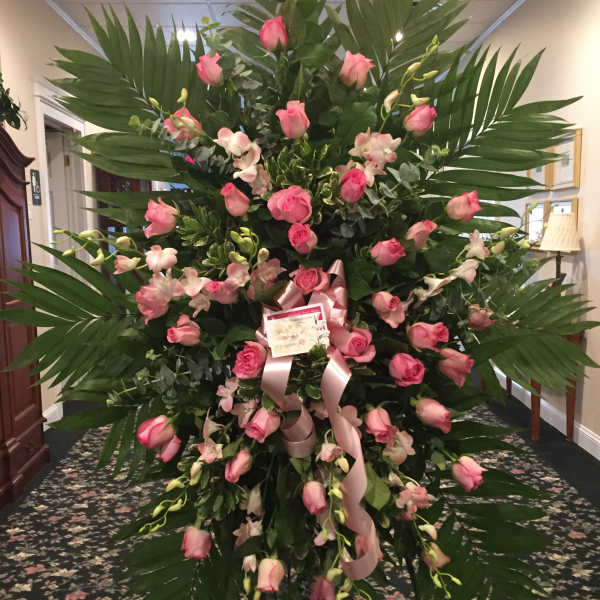 Large standing floral spray with pink roses and orchids