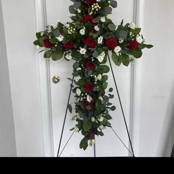 Cross-shaped floral standing spray with red and white roses