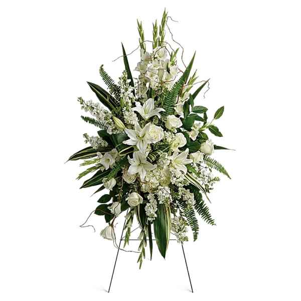 Tall white floral standing spray on an easel