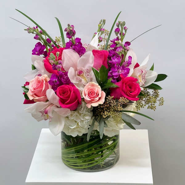 Pink and white mixed bouquet in a clear glass vase